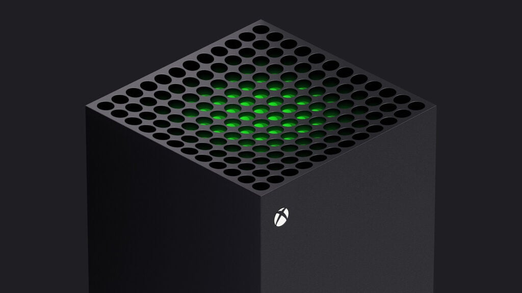 Vorderansicht einer grauen Xbox, die auf einem schwarzen Hintergrund steht
