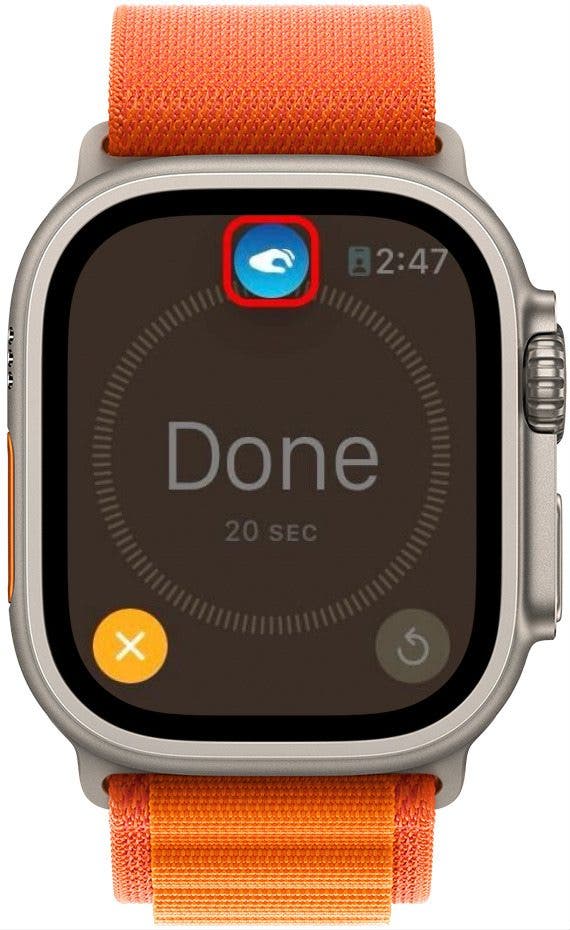 Apple-Watch-Timer-Fertig-Bildschirm mit abgeblendetem Hintergrund, hervorgehobener Stopp-Schaltfläche und einem roten Kreis um das Doppeltipp-Symbol oben auf dem Bildschirm